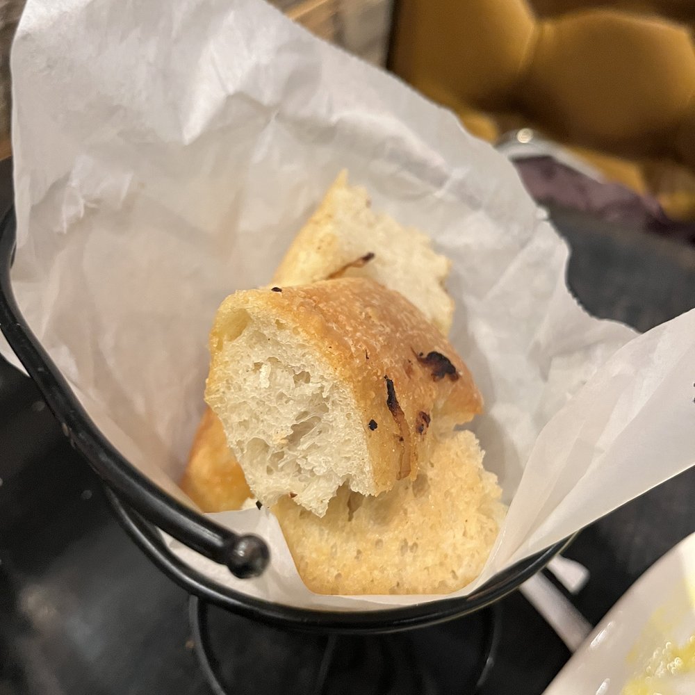 Not Your Average Joe's - Waltham - Complimentary bread - I think it was onion focaccia - New American Near Me - Waltham, Massachusetts Not Your Average Joe's - Waltham - Complimentary bread - I think it was onion focaccia - New American Near Me - Waltham, Massachusetts