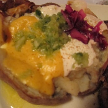 Clearman's Steak 'N Stein - Baked potato with cheese, sour cream, chives, and red cabbage - Steakhouses Near Me - Pico Rivera, California Clearman's Steak 'N Stein - Baked potato with cheese, sour cream, chives, and red cabbage - Steakhouses Near Me - Pico Rivera, California