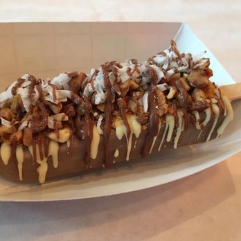 Milk and Wood - Almond roca, with nuts, butterfinger, coconut and chocolate drizzle - Gelato Near Me - Chicago, Illinois Milk and Wood - Almond roca, with nuts, butterfinger, coconut and chocolate drizzle - Gelato Near Me - Chicago, Illinois