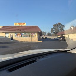 Outside. Right behind the Mexican restaurant, same building.