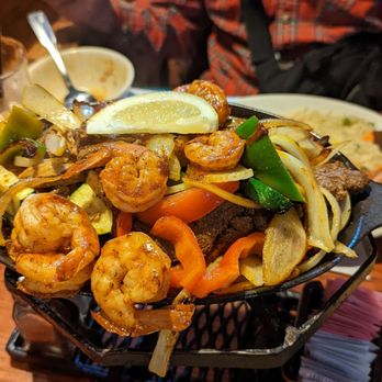 El Patio Mexican Grill - A close up of the trio fajitas platter - Mexican Near Me - Bakersfield, California El Patio Mexican Grill - A close up of the trio fajitas platter - Mexican Near Me - Bakersfield, California