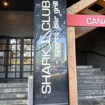 Shark Club Sports Bar & Grill - The entrance with goofy sideways sign - Sports Bars Near Me - Vancouver, British Columbia