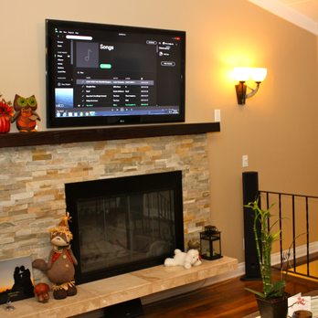 MG Audio Video Design - 55" TV mounted over Fireplace. - Home Theatre Installation Near Me MG Audio Video Design - 55" TV mounted over Fireplace. - Home Theatre Installation Near Me