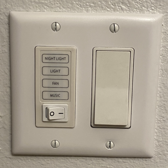 Baumel Brothers Electrical - New switch (left) installed for bathroom fan w/ bluetooth speaker - Electricians Near Me - Long Beach, California
