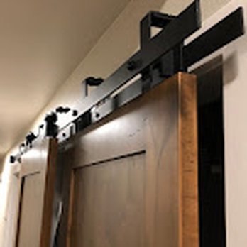 Hall Construction WYO - a barn door with a sliding track - General Contractors Near Me Hall Construction WYO - a barn door with a sliding track - General Contractors Near Me