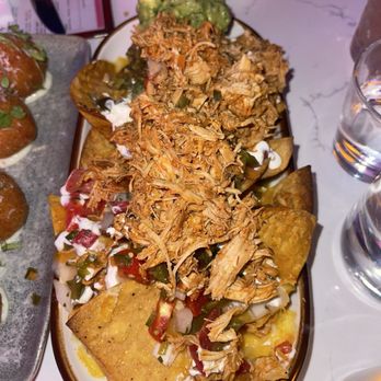 Winnie’s Broadway - Chicken nachos, definitely meant to be shared - Cocktail Bars Near Me - New York, New York Winnie’s Broadway - Chicken nachos, definitely meant to be shared - Cocktail Bars Near Me - New York, New York
