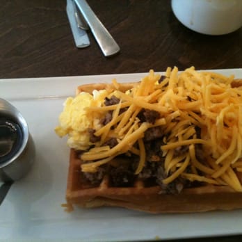 Syrup - Norman - The Morning Glory: scrambled eggs, bacon or sausage and cheddar over a fluffy, slightly sweet waffle. - Breakfast & Brunch Near Me - Norman, Oklahoma Syrup - Norman - The Morning Glory: scrambled eggs, bacon or sausage and cheddar over a fluffy, slightly sweet waffle. - Breakfast & Brunch Near Me - Norman, Oklahoma