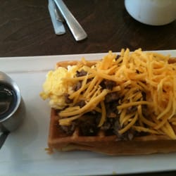 Syrup - Norman - The Morning Glory: scrambled eggs, bacon or sausage and cheddar over a fluffy, slightly sweet waffle.
