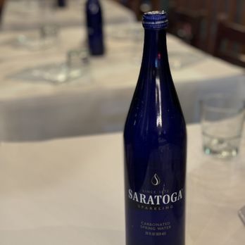 Rangoon Ruby - a blue wine bottle on a table - Asian Fusion Near Me - Palo Alto, California Rangoon Ruby - a blue wine bottle on a table - Asian Fusion Near Me - Palo Alto, California