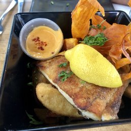Barramundi and chips with a delicious spicy dipping sauce. Yummy!