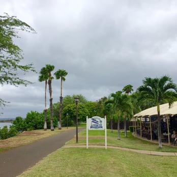 Wright Bros Cafe & Grille - Pearl Harbor Channel on the left and Wright Brothers lanai on the right (taken from the popular running path at Aloha Aina Park) - Cafes Near Me - Honolulu, Hawaii