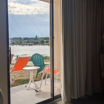 The Bay Resort Waterfront Hotel - Patio in ADA Bayside King room. Threshold is a little bit of a hump. - Hotels Near Me - Dewey Beach, Delaware The Bay Resort Waterfront Hotel - Patio in ADA Bayside King room. Threshold is a little bit of a hump. - Hotels Near Me - Dewey Beach, Delaware