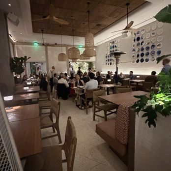 Kyma - Open air dining, screens lowered. - Mediterranean Near Me - West Palm Beach, Florida Kyma - Open air dining, screens lowered. - Mediterranean Near Me - West Palm Beach, Florida