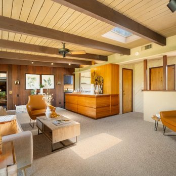 Storybook Styling - Mid-Century Modern Entry Living Room - chance to play up the carmel with rich leather and pops of orange in this Staging Storybook Styling - Home Staging Near Me