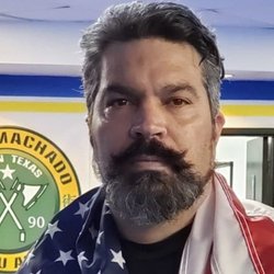 John Machado Brazilian Jiu-Jitsu Academy - Professor John Machado (Coral Belt) watching two black belt practicing at John machado Brazilian Jiu Jitsu Academy in Allen, TX. John is the