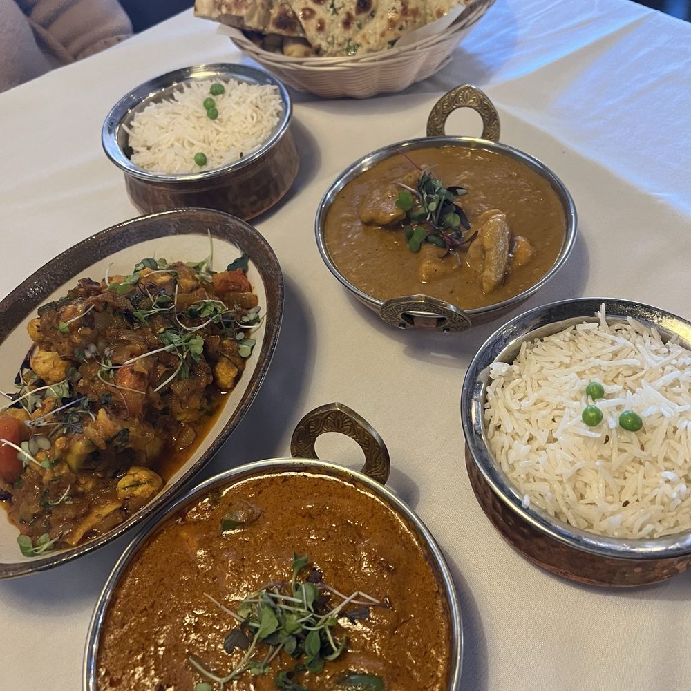 Paneer Butter Masala, Chicken Korma and Aromatic Dum Aloo Gobi, Bread Basket (Assorted Breads)