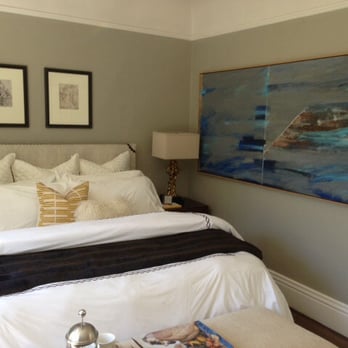 HandyDan - a bedroom with a large painting on the wall - Handyman Near Me - San Francisco, California