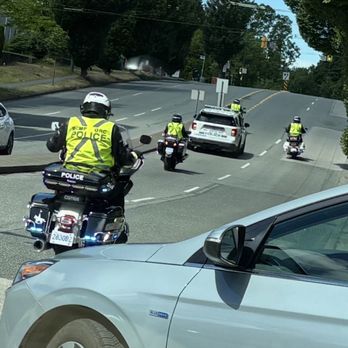 Killarney Community Centre - Police motorcycle and a police van are escorting the soccer players on the road! - Parks Near Me - Vancouver, British Columbia Killarney Community Centre - Police motorcycle and a police van are escorting the soccer players on the road! - Parks Near Me - Vancouver, British Columbia