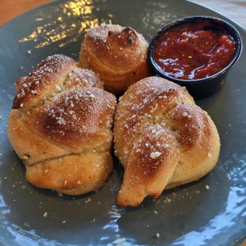 Best Pizza & Brew Chandler - Garlic knots with 1 half eaten. - Pizza Near Me - Chandler, Arizona Best Pizza & Brew Chandler - Garlic knots with 1 half eaten. - Pizza Near Me - Chandler, Arizona