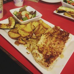 Fresh fish dinner (white king salmon, salad, and potatoes/cucumbers/onions roasted to perfection). Fresh fish dinner (white king salmon, salad, and potatoes/cucumbers/onions roasted to perfection).