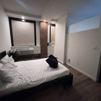 The Haas Building - Queen size bed. Booked for a two queen bed, the other bed is in the living room/kitchen area. Photo is taken from the walk in closet - Apartments Near Me - Los Angeles, California