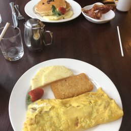 Philly cheesesteak omelette and chocolate chip pancakes with a side of bacon!