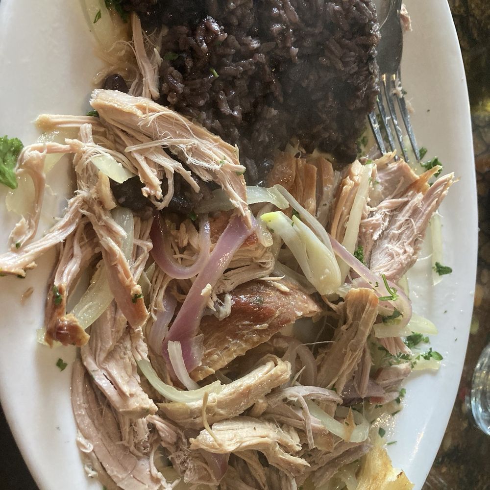 Bella Cuba - Suckling Roast Pig with beans and rice - Cuban Near Me - Miami Beach, Florida Bella Cuba - Suckling Roast Pig with beans and rice - Cuban Near Me - Miami Beach, Florida
