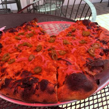 Mia's Brick Oven Pizza - The bbq chicken jalapeño pizza. The color is off because the umbrella providing us shade made everything look red. - Pizza Near Me - Cold Springs, California Mia's Brick Oven Pizza - The bbq chicken jalapeño pizza. The color is off because the umbrella providing us shade made everything look red. - Pizza Near Me - Cold Springs, California