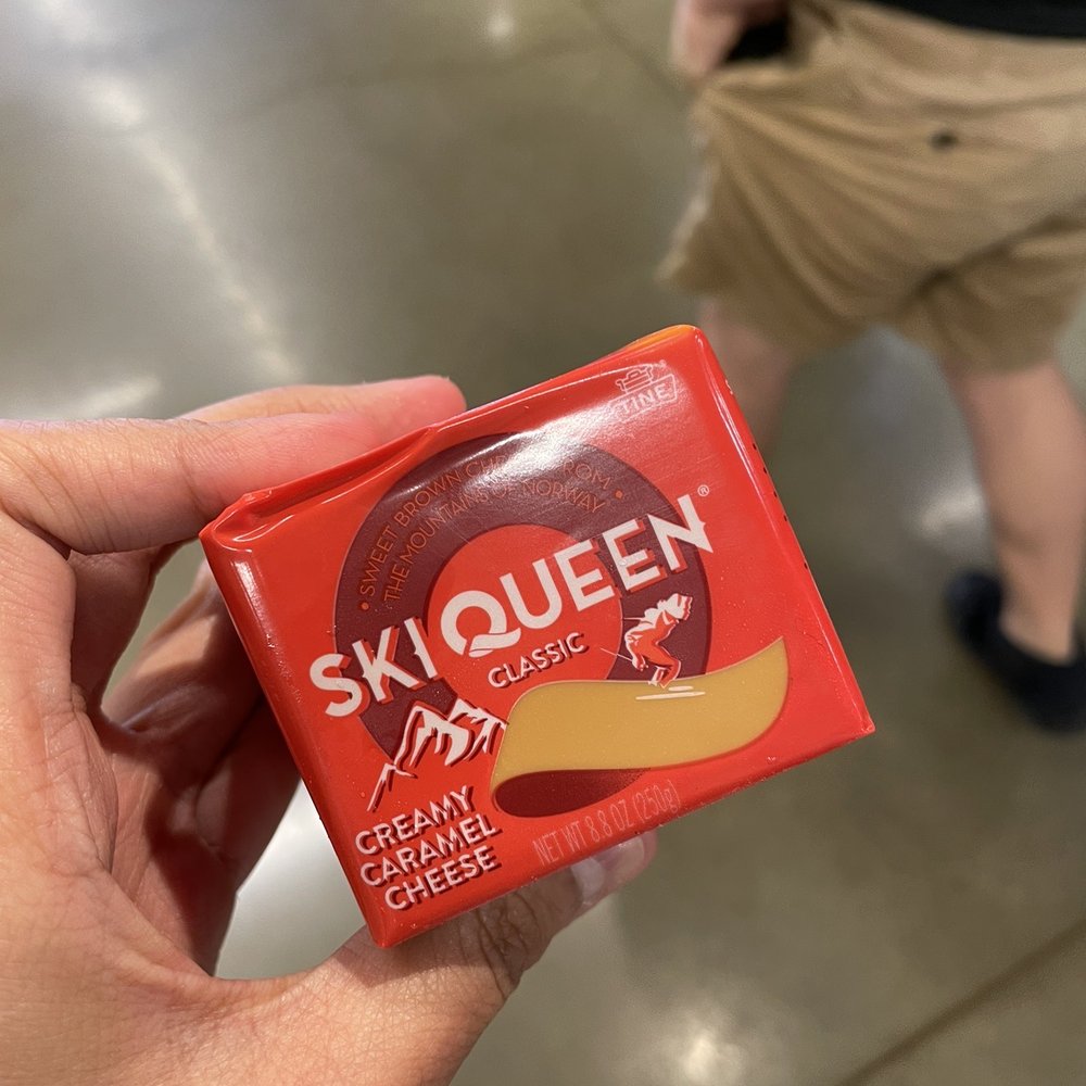 a hand holding a packet of skiqueen a hand holding a packet of skiqueen