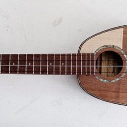 Sonny D Ukuleles - My custom Sonny D, long neck concert pineapple curly koa ukulele.  Great sounding easy to play and beautiful ukulele.