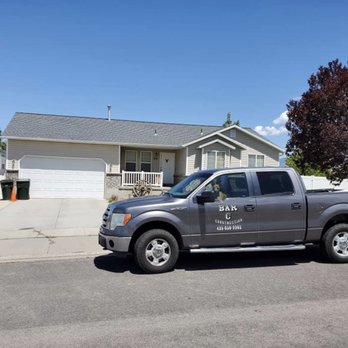 Bar C Construction - a truck parked in front of a house - General Contractors Near Me Bar C Construction - a truck parked in front of a house - General Contractors Near Me