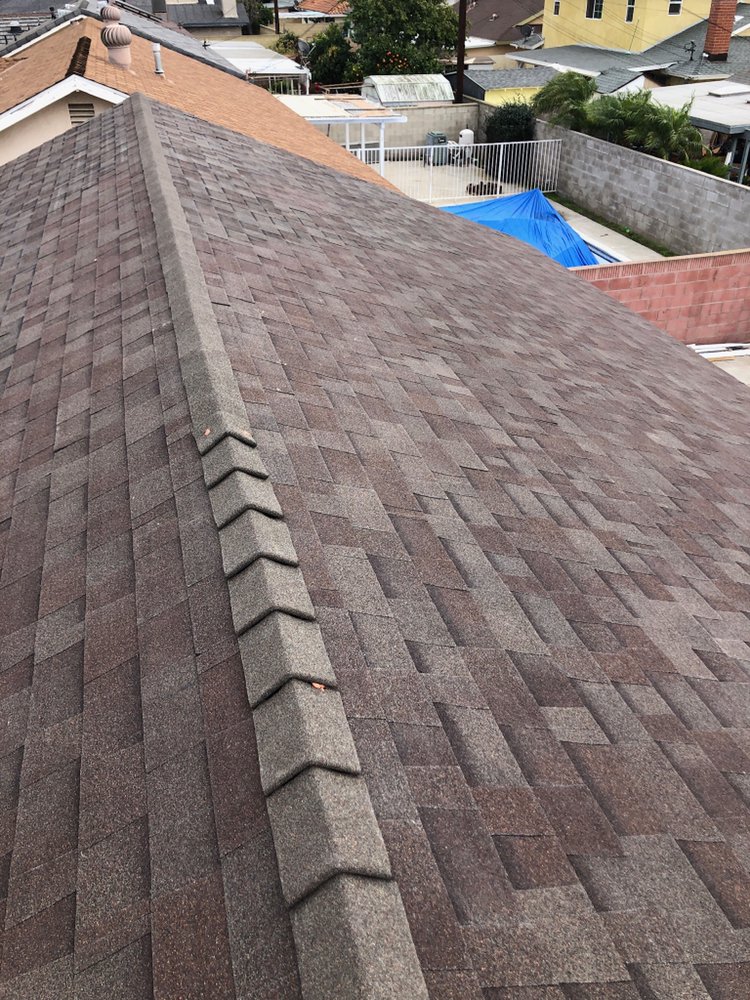 Slide of Olive Tree Roofing and Construction