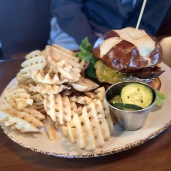 Craftsman Table & Tap - Pretzel bun bacon Cheeseburger with side of waffle fries. - Gastropubs Near Me - Middleton, Wisconsin Craftsman Table & Tap - Pretzel bun bacon Cheeseburger with side of waffle fries. - Gastropubs Near Me - Middleton, Wisconsin