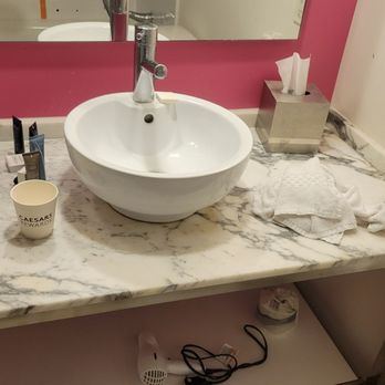 Flamingo Las Vegas - Wet towels, dirty cup on bathroom counter - Hotels Near Me - Las Vegas, Nevada Flamingo Las Vegas - Wet towels, dirty cup on bathroom counter - Hotels Near Me - Las Vegas, Nevada