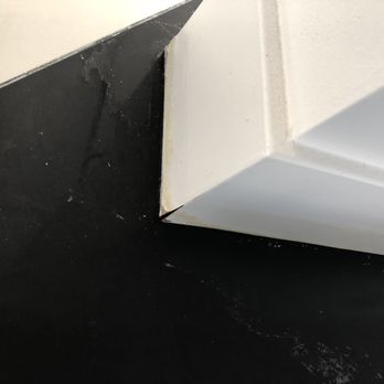 Precision Clean East Bay - Damage baseboard from getting it wet and wax residue from improperly sealing porcelain tile - Carpet Cleaning Near Me Precision Clean East Bay - Damage baseboard from getting it wet and wax residue from improperly sealing porcelain tile - Carpet Cleaning Near Me