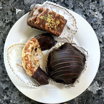 Copenhagen Bakery & Cafe - Mozart (bottom-right), Almond Horn (bottom-left), Chocolate Petit Four (top) - Bakeries Near Me - Burlingame, California Copenhagen Bakery & Cafe - Mozart (bottom-right), Almond Horn (bottom-left), Chocolate Petit Four (top) - Bakeries Near Me - Burlingame, California