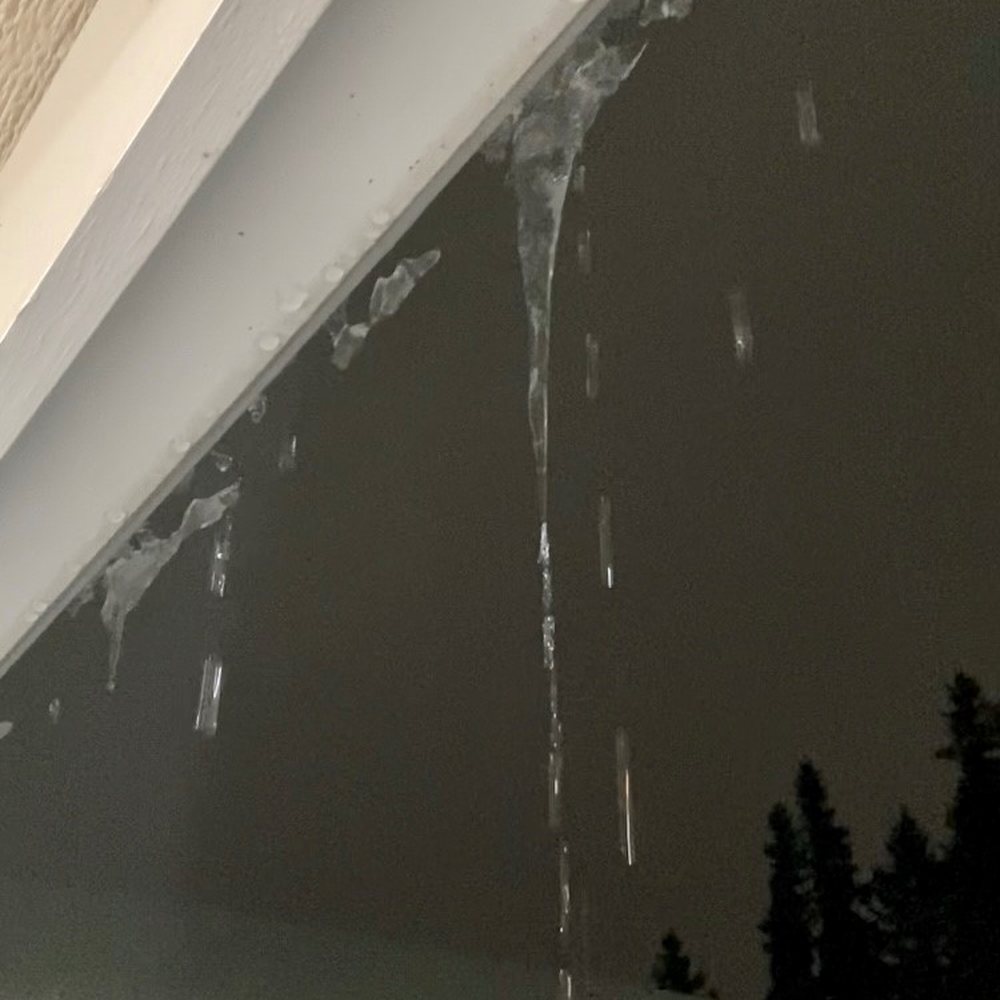LeafFilter Gutter Protection - melting snow overflowing everywhere, creating dangerous icicles over front porch. - Gutter Services Near Me - Hudson, Ohio LeafFilter Gutter Protection - melting snow overflowing everywhere, creating dangerous icicles over front porch. - Gutter Services Near Me - Hudson, Ohio
