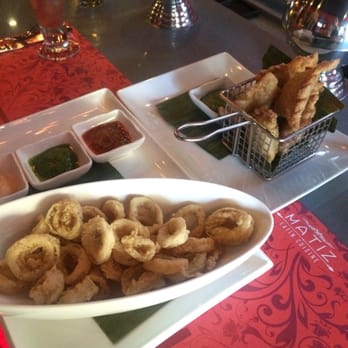 Matiz Latin Cuisine - Calamari (perfectly cooked, flavorful with no hint of rubberiness) and empanadas photobombing in the background - also Yummy. - Latin American Near Me - Forest Hills, New York Matiz Latin Cuisine - Calamari (perfectly cooked, flavorful with no hint of rubberiness) and empanadas photobombing in the background - also Yummy. - Latin American Near Me - Forest Hills, New York