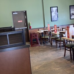 a restaurant with tables and chairs