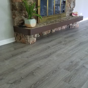 All Flooring Service - a fireplace with a stone mantle - Flooring Near Me - Niles, Illinois All Flooring Service - a fireplace with a stone mantle - Flooring Near Me - Niles, Illinois