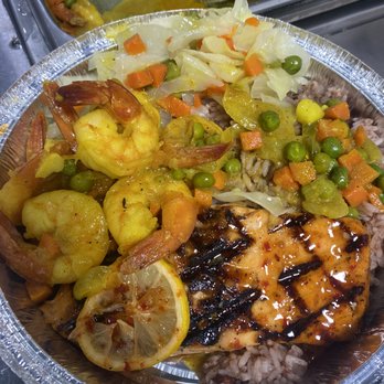 MacKariba Kitchen - a plate of food on a table - Seafood Near Me - Irvington, New Jersey
