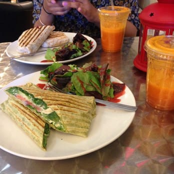 Manhattan Juice Bar and Cafe - To the bottom, the Hummus Wrap, and more up, the Thai Chicken Salad wrap accompanied with two Orange Cleanse juices. - Juice Bars & Smoothies Near Me - Bloomfield NJ., New Jersey
