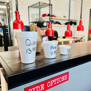 Porter's Real Barbecue - a counter with cups of food on it - Barbeque Near Me - Spokane, Washington Porter's Real Barbecue - a counter with cups of food on it - Barbeque Near Me - Spokane, Washington