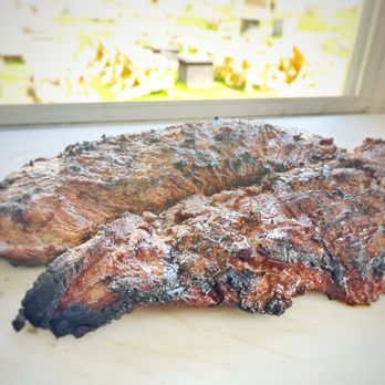 The Outlaw Kitchen - a close up of a steak on a cutting board - Food Trucks Near Me - Winchester, New Hampshire The Outlaw Kitchen - a close up of a steak on a cutting board - Food Trucks Near Me - Winchester, New Hampshire