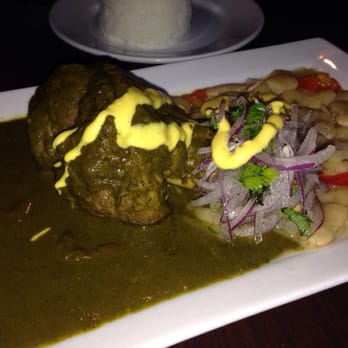 Piqueo's - Seco de Cordero: Lamb Shank cooked in its own juices w/ Cuzquena beer-spinach sauce, Panamito beans, & steamed rice - Latin American Near Me - San Francisco, California Piqueo's - Seco de Cordero: Lamb Shank cooked in its own juices w/ Cuzquena beer-spinach sauce, Panamito beans, & steamed rice - Latin American Near Me - San Francisco, California