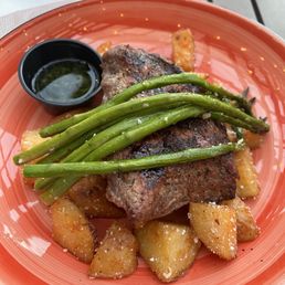 Steak with potato's and Asparagus, side of chimichurri sauce Steak with potato's and Asparagus, side of chimichurri sauce