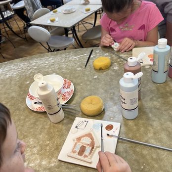 Petroglyph Ceramic Lounge - Grand kids hard at work on their projects - Paint-Your-Own Pottery Near Me - Roseville, California