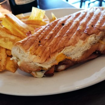 Deluxe 1717 - cuban sandwich : slow roasted pork shoulder, house smoked pork belly, jambon gruyere mojo, pickles [served with crisp plantain chips] - American Near Me - Pasadena, California