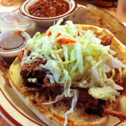 Three C's Diner - Slawburger Dinner: A pulled pork sandwich topped with slaw and served with baked beans and a baked potato and side salad.