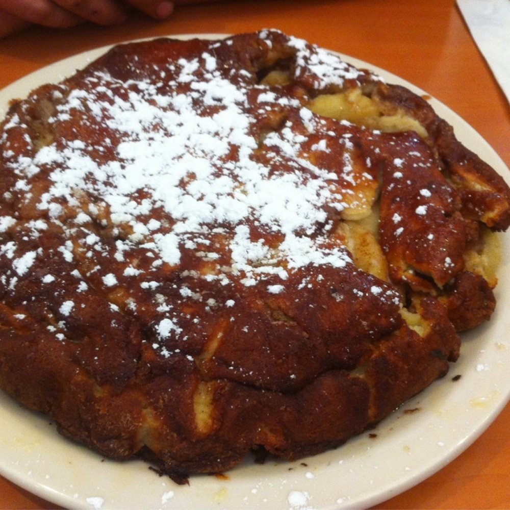 Apple Villa Cafe - The baked apple pancake. Expect a sugar high shortly after! - Breakfast & Brunch Near Me - Batavia, Illinois Apple Villa Cafe - The baked apple pancake. Expect a sugar high shortly after! - Breakfast & Brunch Near Me - Batavia, Illinois